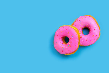 Pink donuts on blue background.