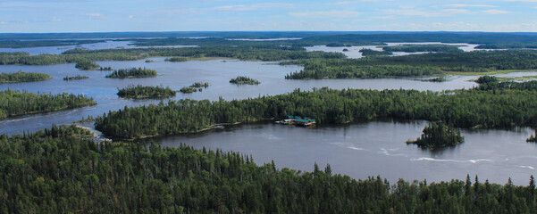 Arial view of lake and cabin