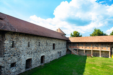 Fototapeta na wymiar medieval fortress with brick walls and ramparts