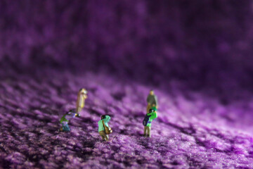 miniature people, group of photographer taking picture in lavender field concept