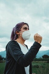 woman with mask running in the park