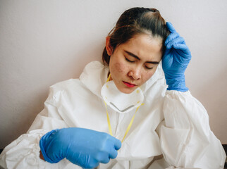 Healthcare worker with acne and facial wounds occur from a medical mask after work for a longtime...