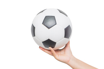 Young man holding classic leather soccer ball isolated on white background. Traditional black and white football equipment to play a competitive game. This photo can be used for sport concept.