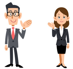 案内するビジネスマンの男女の全身
