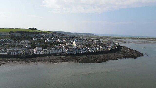 Appledore Devon small coastal town aerial panning left to right along waterfront tide out
summers day tide is out