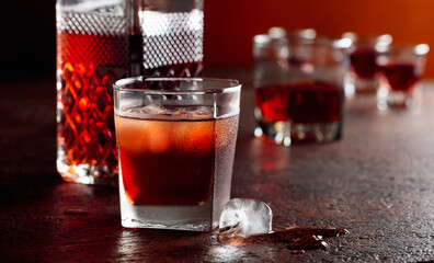 Whiskey in frosted glass with ice.