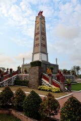 Hoi An, Vietnam, February 29, 2020: Vertical view of the commemorative monolith located in the gardens of the Martyrs Cemetery in Hoi An 