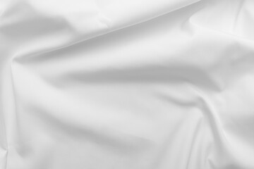 Obraz premium Abstract white fabric texture background. Cloth soft wave. Creases of satin, silk, and cotton. 