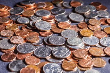 American coins and US dollars on a wooden table
