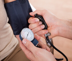 Doctor checking blood pressure
