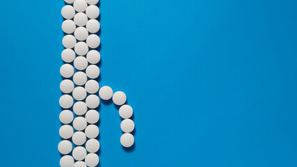 Male penis from a tablets on a blue background
