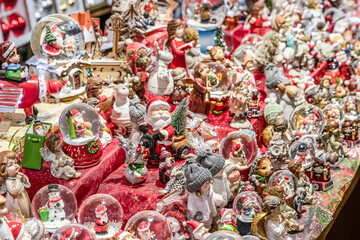 Traditional Souvenirs snow globes and toys Santa Claus Dolls At European Winter Christmas Market Souvenir