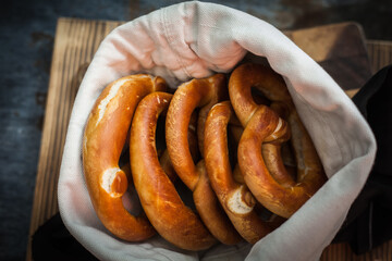Still warm fresh baked pretzels in a cloth bag