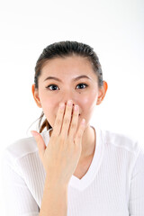 beautiful young south east Asian Chinese healthy hand on mouth surprised on white background