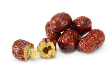Red dried jujube cut with isolated on white background