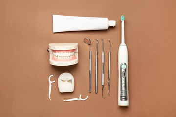 Set for oral hygiene and dental tools on color background