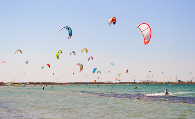 
Kitesurfing. Lots of parachutes over the sea