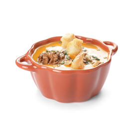 Tasty pumpkin cream soup in pot on white background