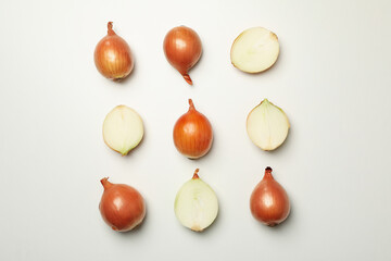 Flat lay with fresh onion on white background, top view