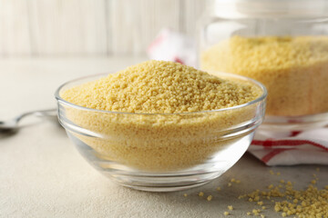 Concept of breakfast with couscous on gray table