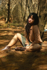 Outdoor lifestyle portrait of beautiful young asian woman on the beach.