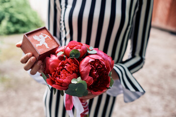 Wedding bouquet in the hands of a girl