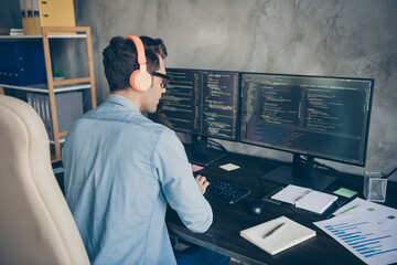 Rear back behind view portrait of his he nice skilled busy geek guy typing php language C plus...