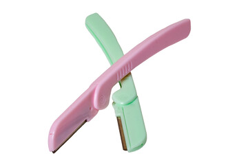 Cosmetic tools. Close-up of a pink and a green eyebrow razor for shaving body hair isolated on a white background. Beauty concept. Macro.