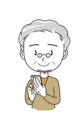 スマホを持っている中年男性・笑顔