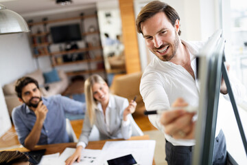 Business team people discussing documents and ideas at meeting