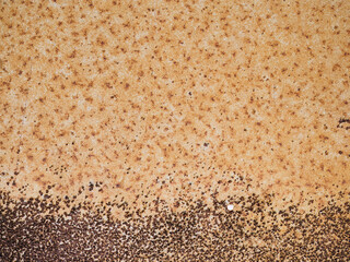 Steel plate filled with orange rust spots