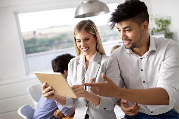 Cheerful coworkers in office during company meeting