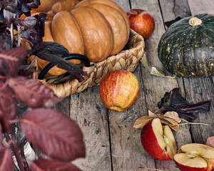 Beautiful rustic still life with pumpkin on wooden background for decorative design. Thanksgiving postcard. Harvest healthy food. Selective focus.