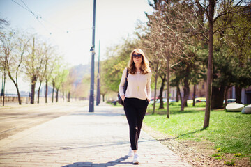 Confident woman walking alone in the city