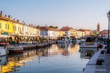Fototapeta na wymiar Colourful fishing boat in the Leonardo's canal harbor of Cesenatico, Emilia Romagna, Italy