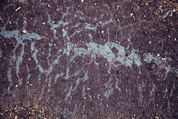 Tierra de residuos negra con goteado de alquitrán