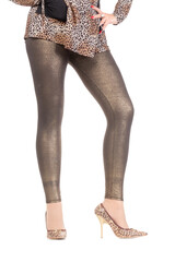 Sexy stylish legs in shimmering golden leggins