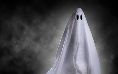 Scary white ghost at big eye for Halloween concept with clipping path