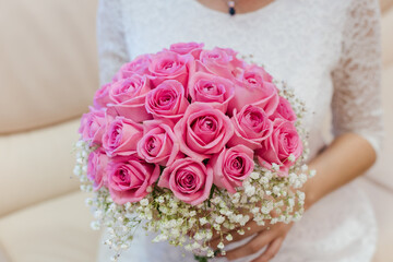 bride holding bouquet, bouquet of pink roses, wedding day, the bride's bouquet