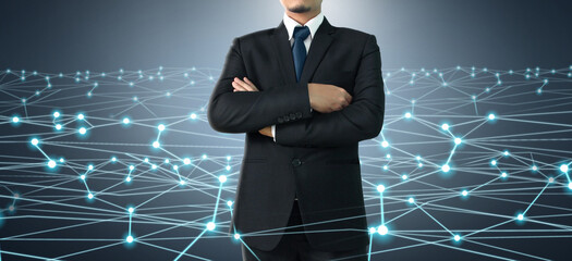 Businessman on blurred background using Social network interface