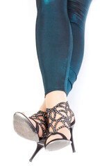 Sexy stylish legs in shimmering green leggins