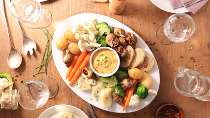 platter of vegetable, seafood and dip sauce