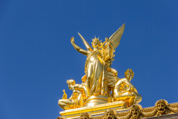 Fototapeta na wymiar Golden statue in the Opera Garnier, Paris, France