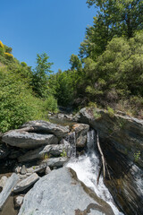 Fototapeta na wymiar Water falling down a waterfall in a river in the Sierra Nevada
