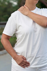 A woman practicing Jin Shin Jyutsu, a japanese self-helping therapy