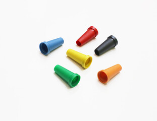 Single use plastic protective colorful mouth tips / caps / mouthpieces for shisha pipe for smoking in a hookah lounge or bar by different people. Used for sanitary purpose prevent the spread of germs