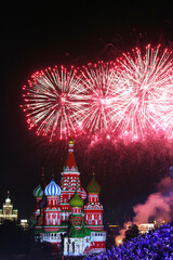 Obraz premium Moscow’s famous St Basil’s cathedral on Red Square during colorful firework/salut. Russian signature sightseeing place. 