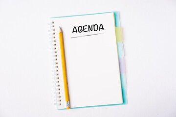 Agenda wordings on a notebook on a table