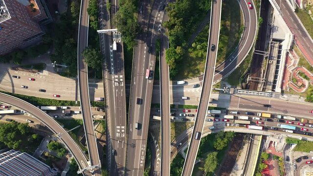 Aerial footage with upward motion of crowded highway intersection in the Hong Kong district of Kowloon in Asia