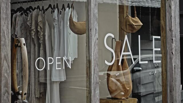 White text on a glass window with the inscription sale